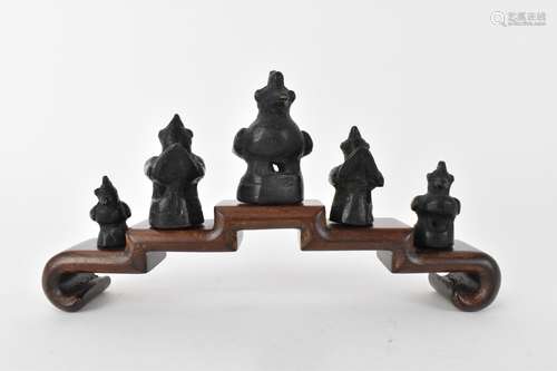 A graduated set of Thai/Burmese bronze opium weights in the ...