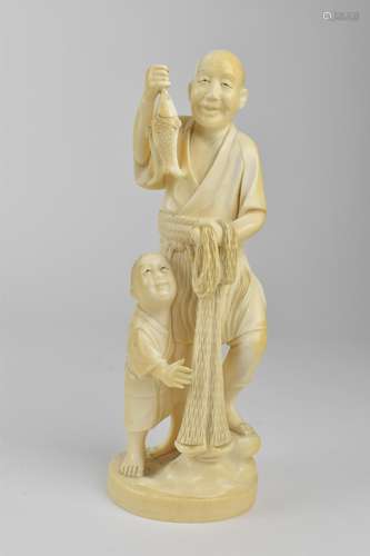 A Japanese Meiji period ivory Okimono of a fisherman holding...