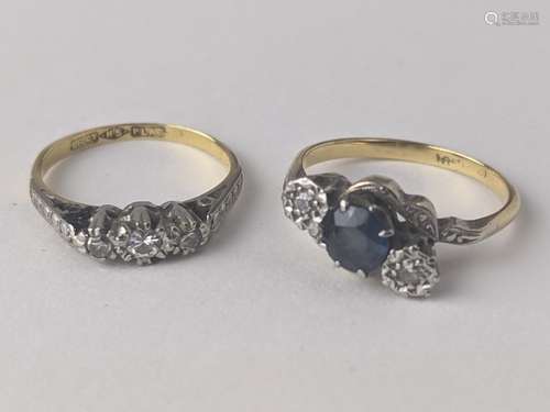 An 18ct gold and platinum diamond and sapphire crossover rin...