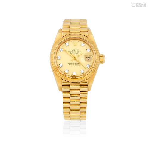 Rolex. A lady's 18K gold diamond set automatic calendar