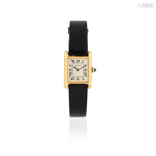 Cartier. A lady's 18K gold manual wind wristwatch