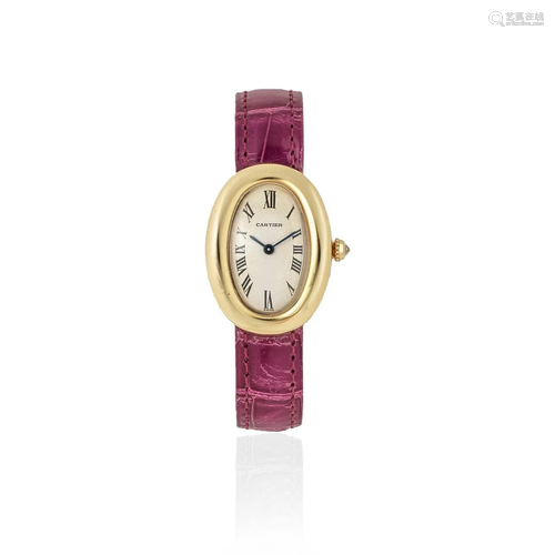 Cartier. A lady's 18K gold quartz oval wristwatch