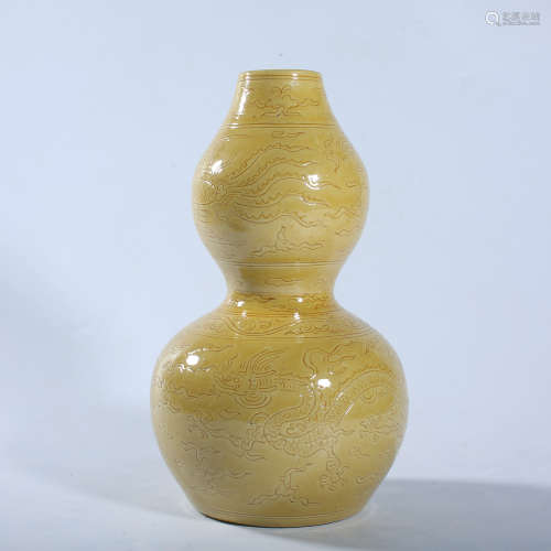 Yellow glaze dark carved gourd bottle with dragon pattern in...