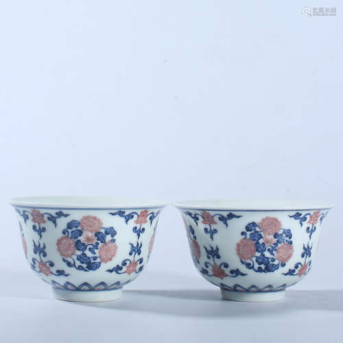 A pair of blue and white underglaze red bowls in Qianlong of...