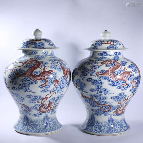 A pair of blue and white underglaze red covered pots in Yong...