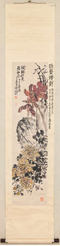 A Chinese Ink Painting by Wu Changshuo: Chrysanthemum admist...