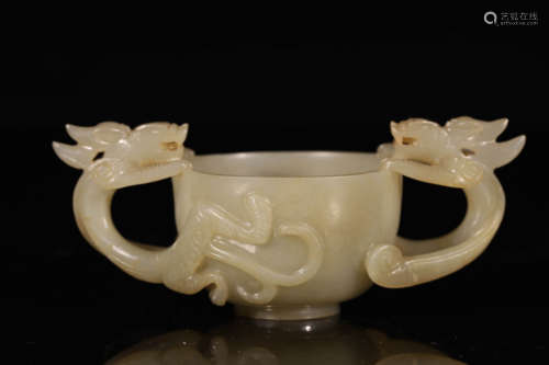 White jade cup with dragon pattern