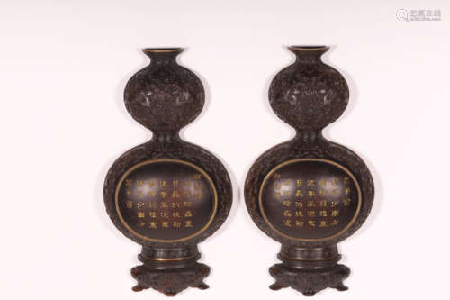 A pair of gourd wall bottles with red sandalwood inscription