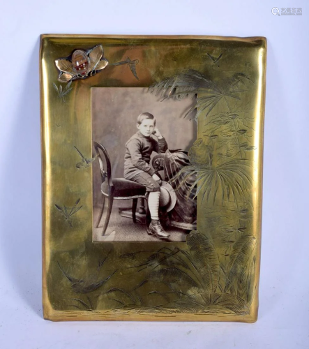 AN ARTS AND CRAFTS BRASS AND AGATE PHOTOGRAPH FRAME
