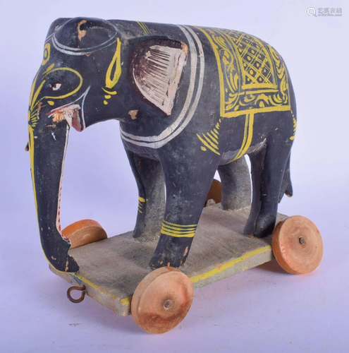 A 19TH CENTURY INDIAN CARVED AND PAINTED WOOD ELEP…