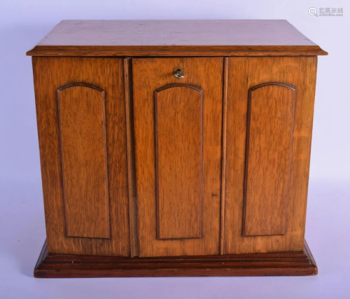 A LARGE LATE VICTORIAN OAK FREE STANDING DESK CABINET