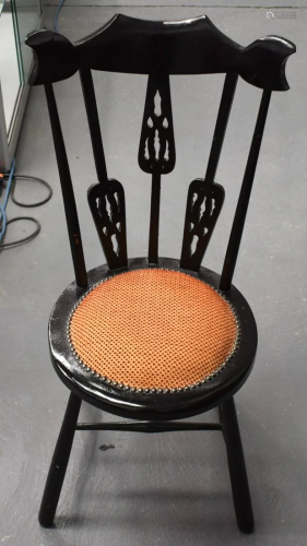AN ARTS AND CRAFTS EBONISED SINGLE CHAIR Attributed to