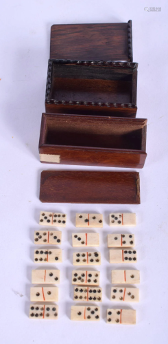 A SET OF EARLY 19TH CENTURY BONE DOMINOS within a…