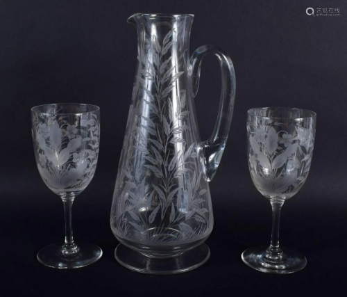 AN ANTIQUE EUROPEAN ENGRAVED GLASS JUG with matching