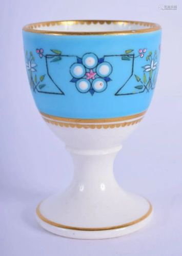 Royal Worcester egg cup decorated in the style of Sir
