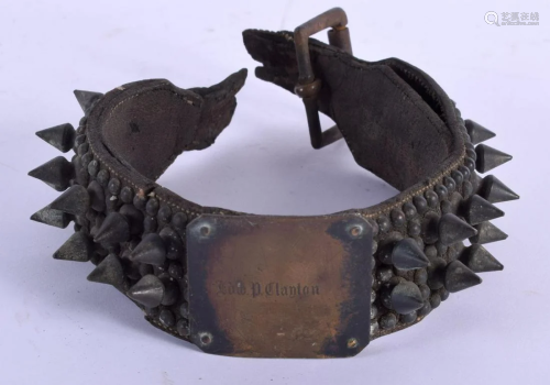 AN EARLY 19TH CENTURY BRUTALIST TYPE BRONZE STUD DOG