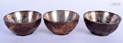 THREE EARLY 18TH CENTURY CHINESE CARVED COCONUT BOWLS