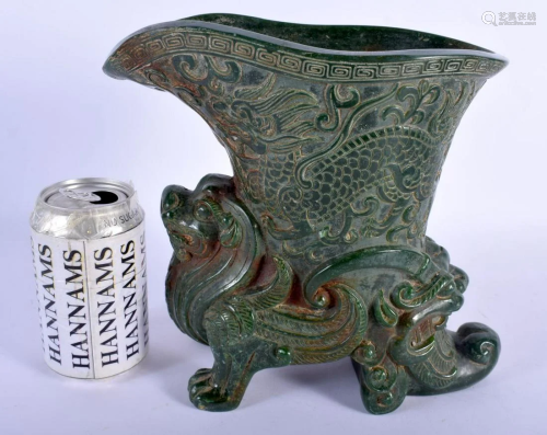 A LARGE CHINESE CARVED GREEN JADE TYPE RHYTON LIBATION