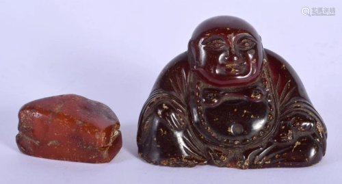 A 19TH CENTURY CHINESE CARVED AMBER FIGURE OF A BUDDHA