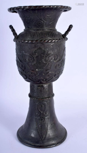A CHINESE TWIN HANDLED BRONZE GU FORM VASE probably