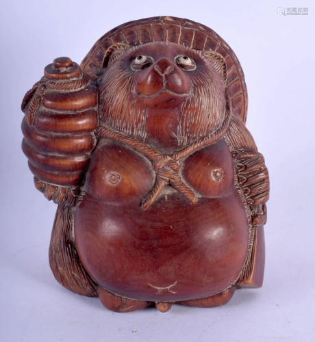A JAPANESE CARVED WOOD FIGURE OF A BEAR modelled