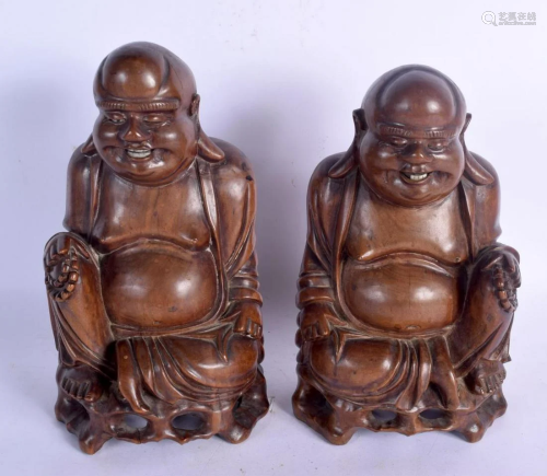 A PAIR OF 19TH CENTURY CHINESE CARVED HARDWOOD FIG…