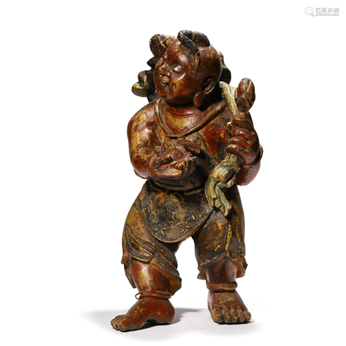 A Carved Wood Figure Of Child