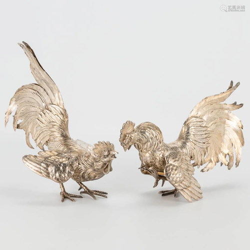 A pair of roosters, made of solid silver and marked