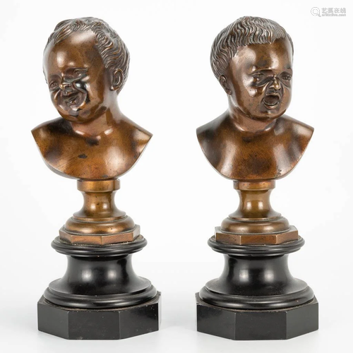 A pair of bronze busts of laughing children mounted on