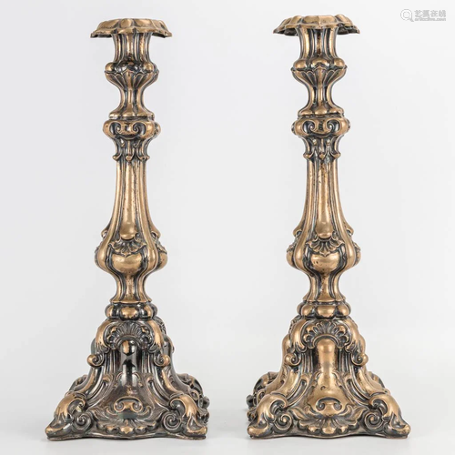 A pair of silver candlesticks, not stamped. 707g.