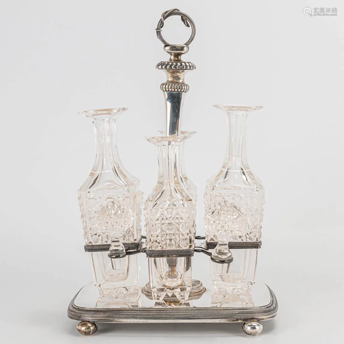 An antique oil and vinegar set made of sterling silver