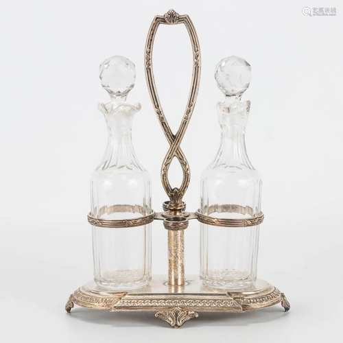 A silver oil and vinegar set made in classical style