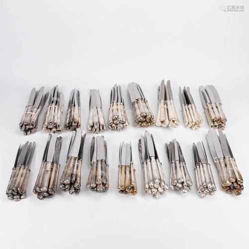 A large collection of silver plated knives, consisting