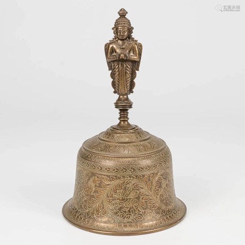 A bell made of bronze in an Oriental style, probably