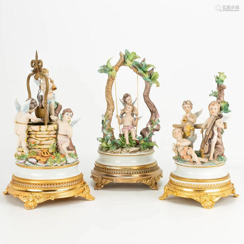 A collection of 3 porcelain statues of playing angels