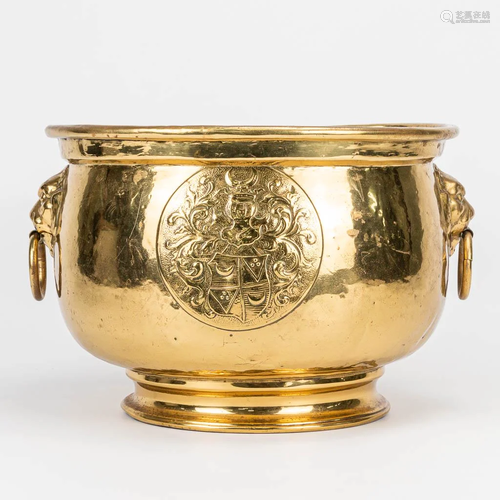 A Champagne cooler made of copper with Heraldic images.