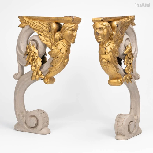 A pair of wood sculptures of angels, patinated gray and