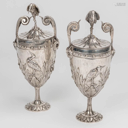 A pair of silver plated vases with lid and decorated