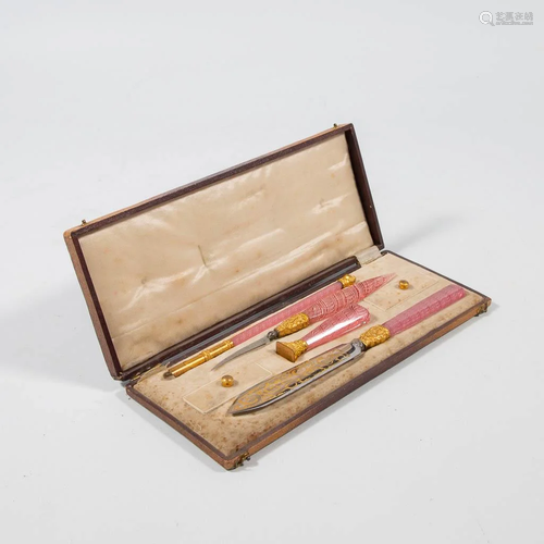 A collection of writing instruments in a case with