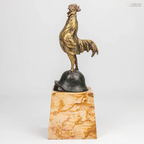 A bronze statue of a rooster standing on a German