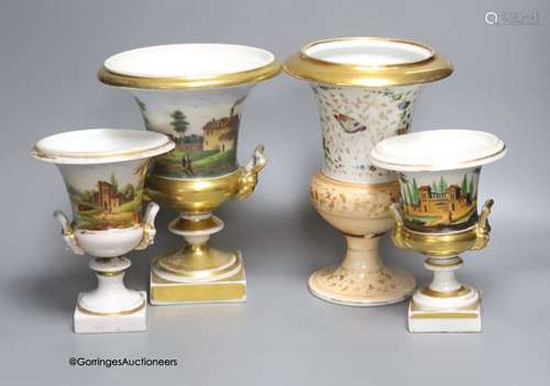 Three Paris porcelain campana urns and another similar vase,...