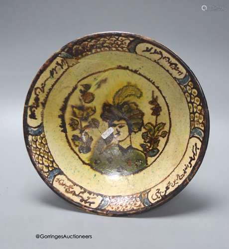 An Islamic bowl with central figure and scripted border, dia...