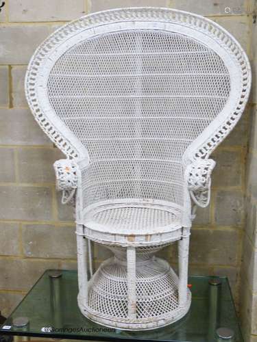 A white painted wickerwork peacock armchair, width 110cm, he...