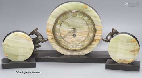 An Art Deco slate and onyx 'antelope' clock garniture, lengt...