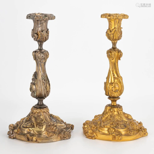 A pair of antique candlestics made in Louis XV style.