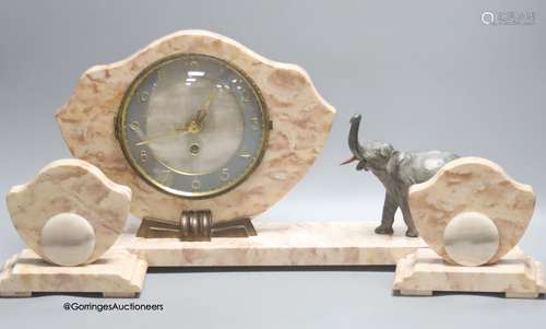 An Art Deco style pink marble 'elephant' clock garniture, le...