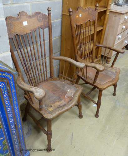 A pair of early 20th century American oak spindle back elbow...