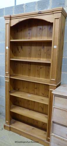 A reproduction tall pine open bookcase, length 94cm, depth 2...