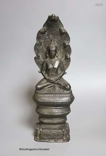 An 18th/19th century Cambodian bronze seated figure of Buddh...