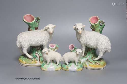 A pair of Staffordshire sheep and a smaller similar pair